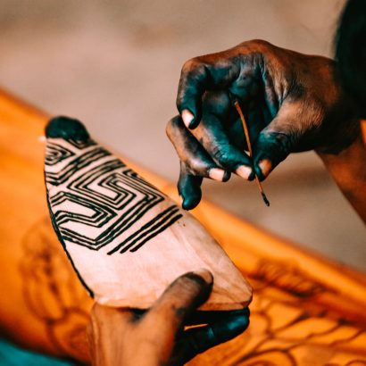 Hands of member of the Asurini tribe of Baixo Amazonas, Rio Xingu, Brazilian Amazon, making tribal art. 2010.